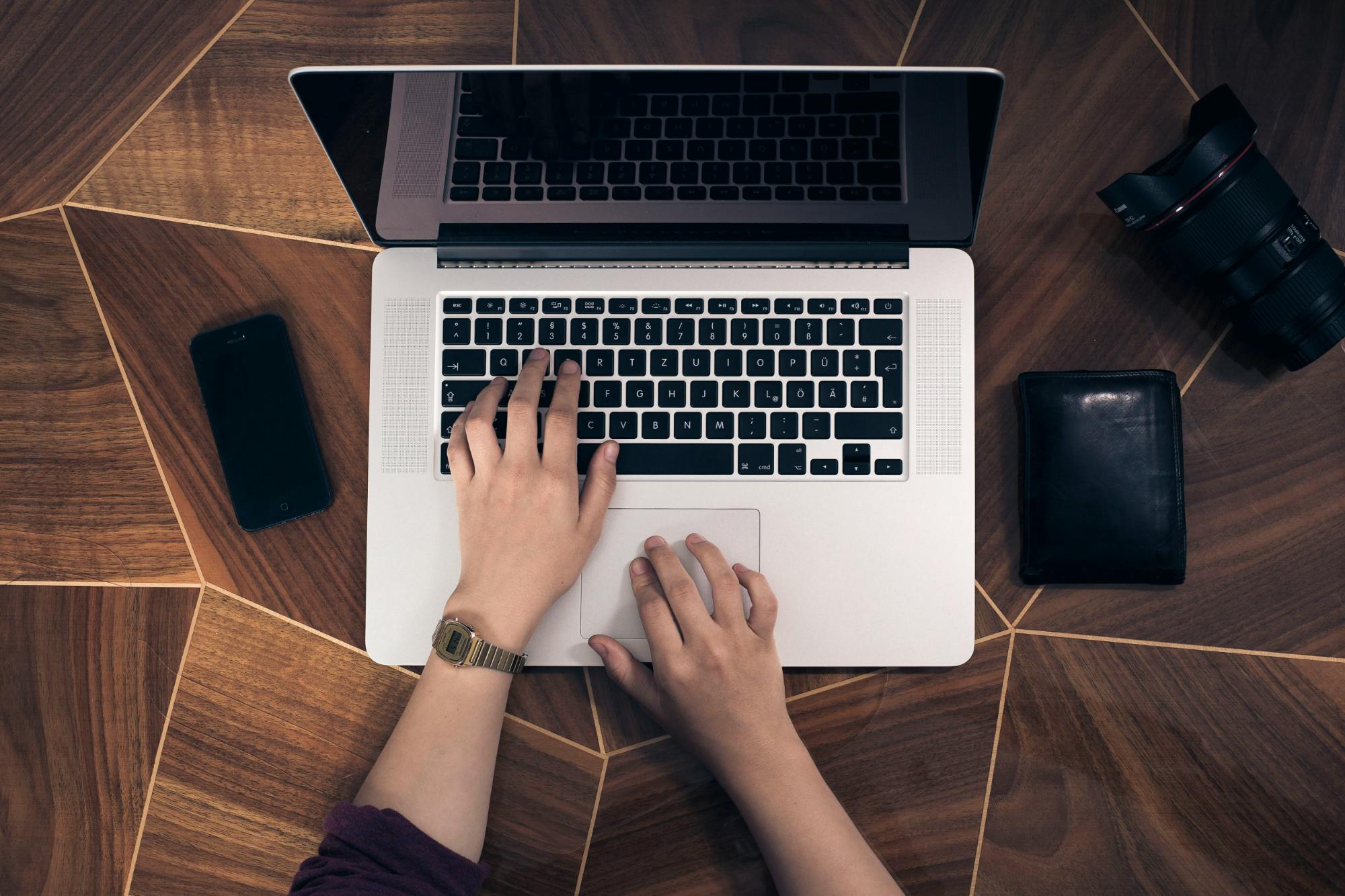 Woman working at a computer Birdseye view of woman working at a computer